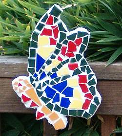 Tile Mosaic Butterfly sculpture attached to a deck railing.